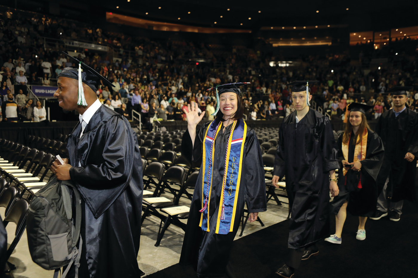 REASON TO SMILE: CCRI graduates proceed into the Dunkin’ Donuts Center before receiving their degrees during the college’s 54th commencement ceremony.